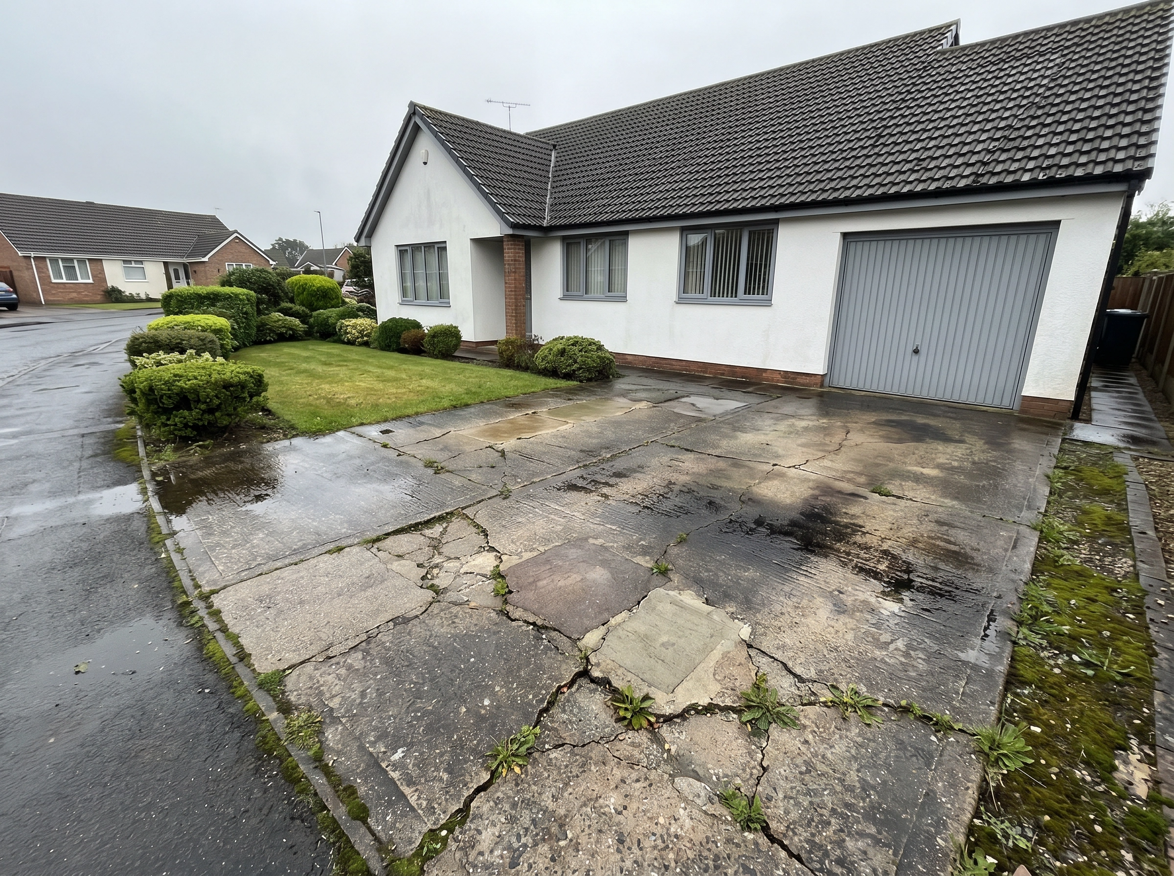 Before: Old cracked driveway